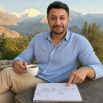 Shahbaz Ahmed founder of KetoFramework in a light blue shirt sitting outdoors in Gilgit-Baltistan pointing at a handwritten fasting window diagram on a notepad while holding black tea smiling directly at camera representing how long should you fast and the complete guide to intermittent fasting hours